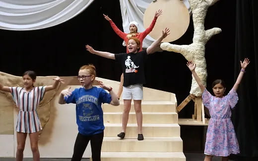 a group of people posing for a photo on stairs