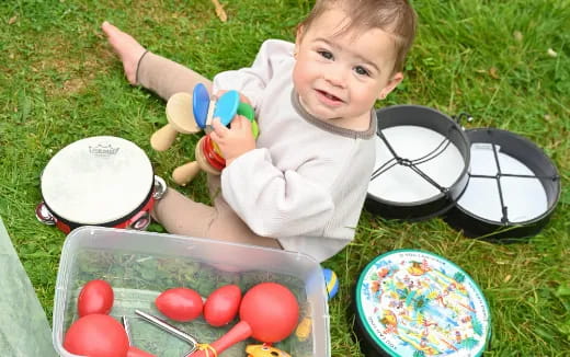 a baby playing with a toy