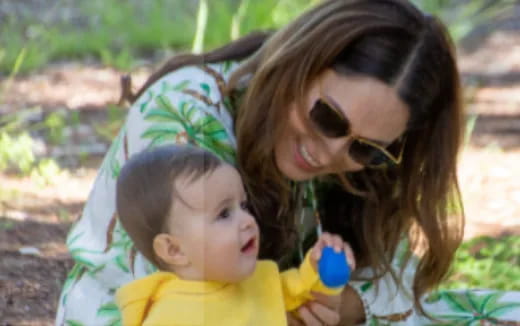 a person holding a baby