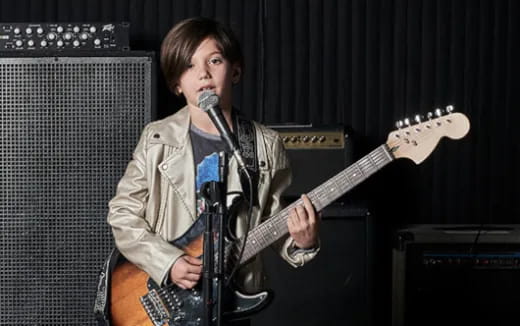 a person playing a guitar