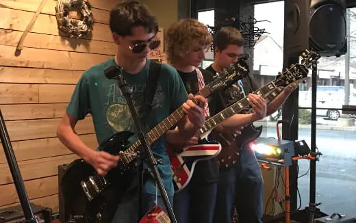 a group of men playing guitars