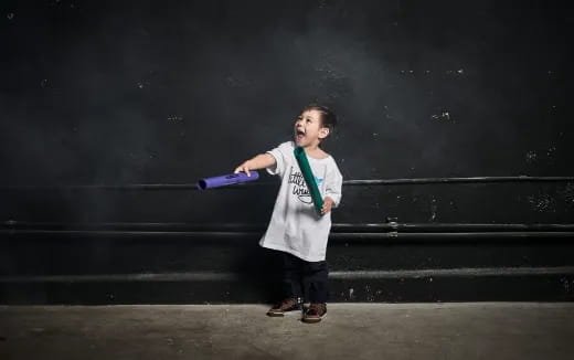 a boy holding a bat