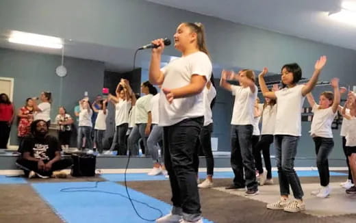 a group of people performing on stage