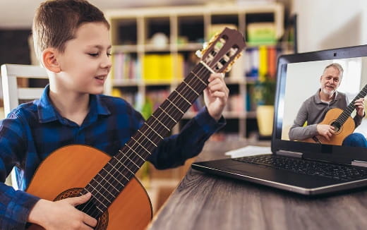 a boy playing a guitar