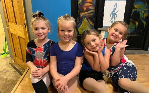 a group of girls posing for a photo