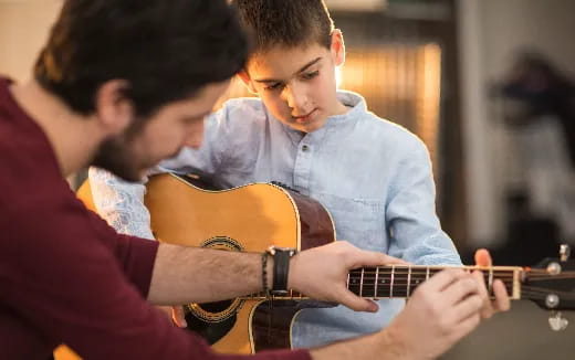 a man playing a guitar