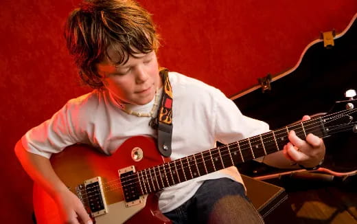 a man playing a guitar