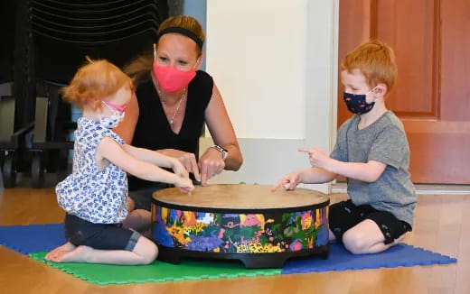 a group of children wearing masks