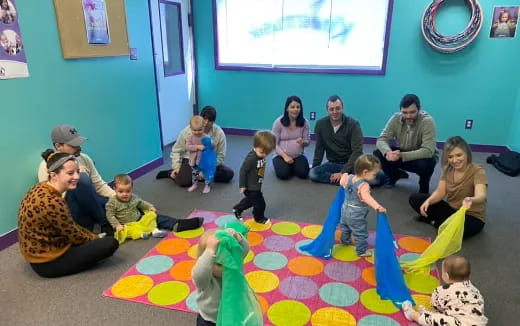 a group of people sitting on the floor