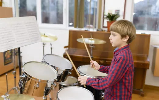a boy playing drums