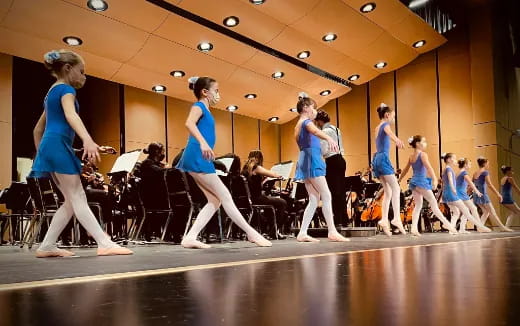 a group of women dancing on a stage