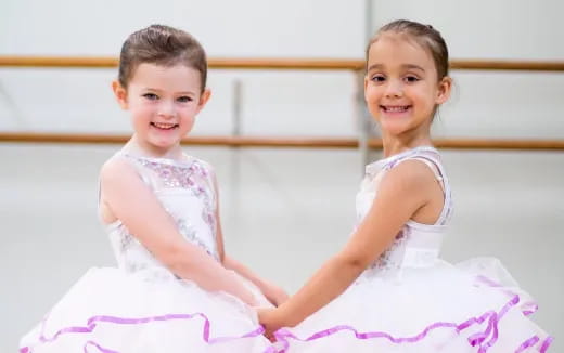 two girls in dresses