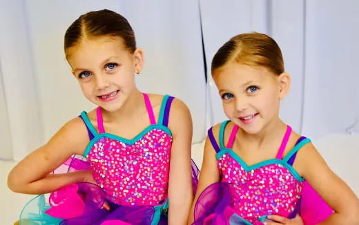 a couple of girls in dresses