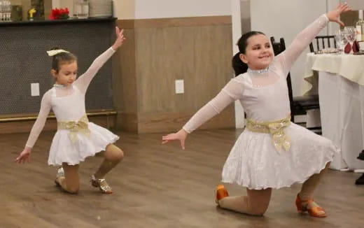 two girls dancing in a room