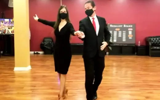 a man and woman dancing