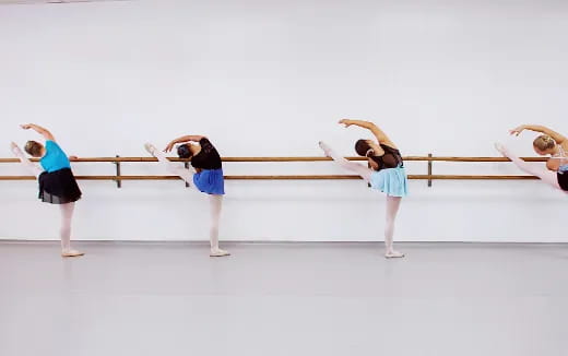 a group of women doing a plank