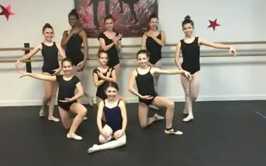 a group of women posing for a photo