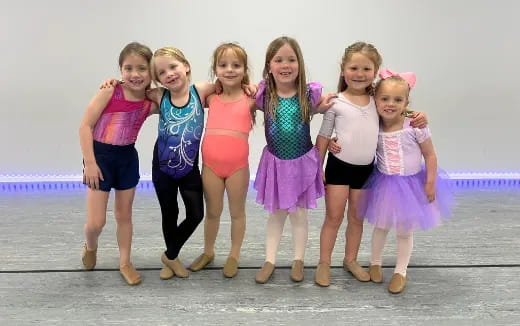 a group of girls posing for a photo