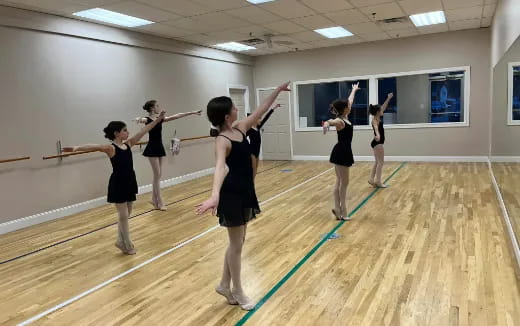 a group of women exercising in a room