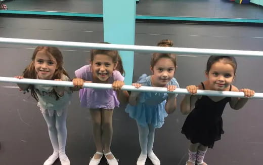 a group of children holding a rope