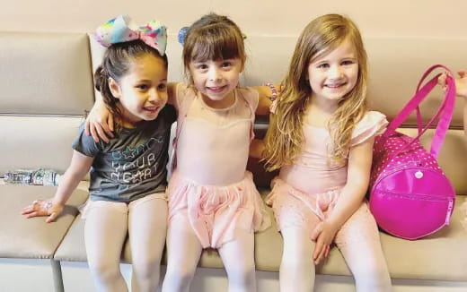 a group of girls sitting on a couch