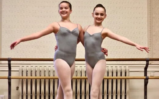 two women in leotards