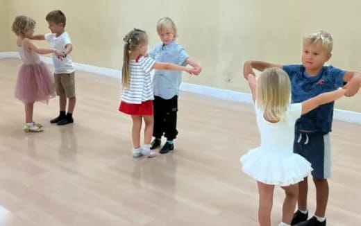 a group of children dancing