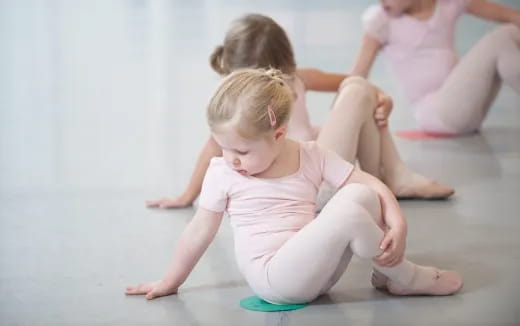 a group of children sitting on the floor