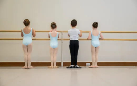 a group of people standing in front of a railing