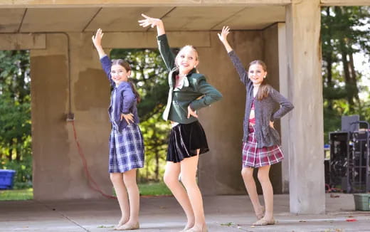 a group of girls posing for a picture