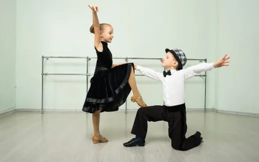 a boy and girl dancing