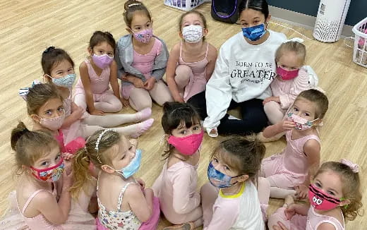 a group of children wearing face masks
