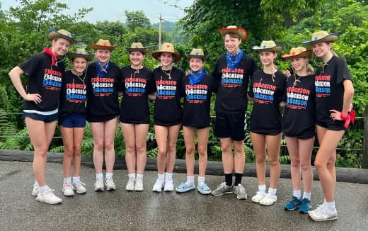 a group of people wearing matching outfits