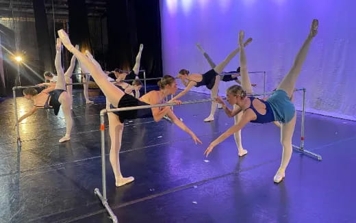 a group of people performing on a stage