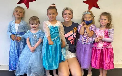 a group of girls wearing clothing