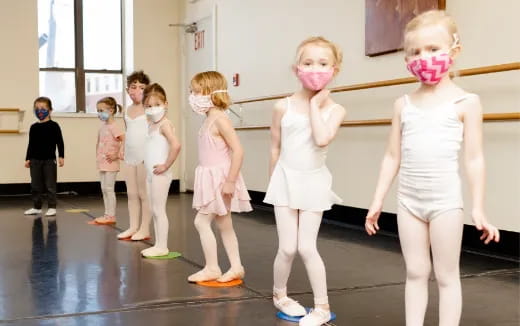 a group of children wearing masks