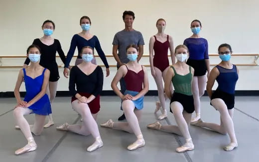 a group of people wearing masks