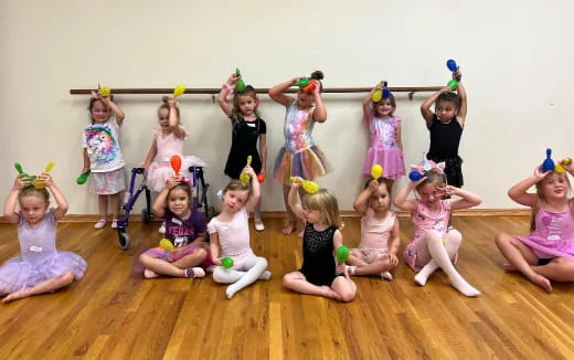a group of girls wearing clothing