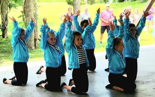 a group of people jumping in the air