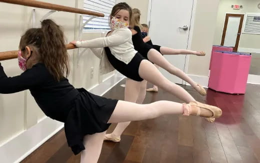 a group of women doing yoga