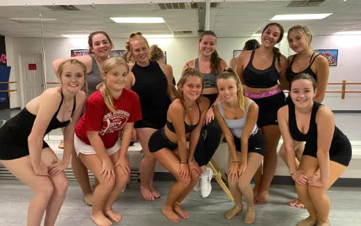 a group of women posing for a photo