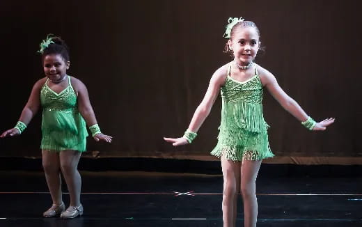 a couple of girls dancing