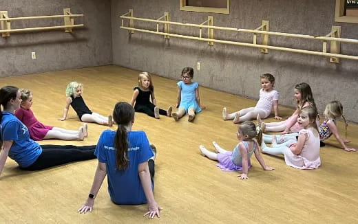 a group of people sitting on the floor