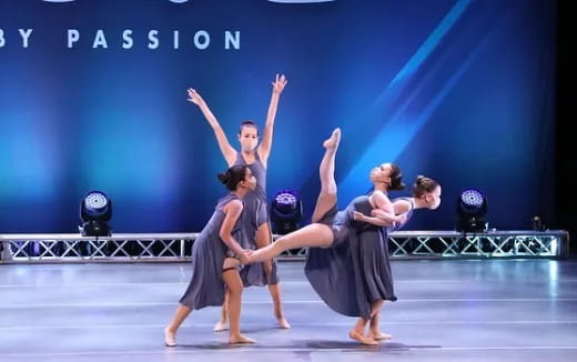 a group of women dancing on a stage