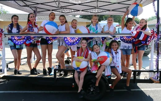 a group of women in a race car