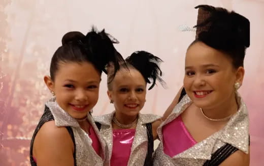 a group of girls smiling