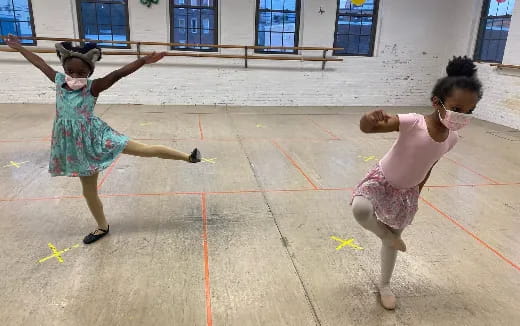 a couple of girls dancing