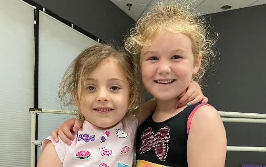 two girls posing for a picture