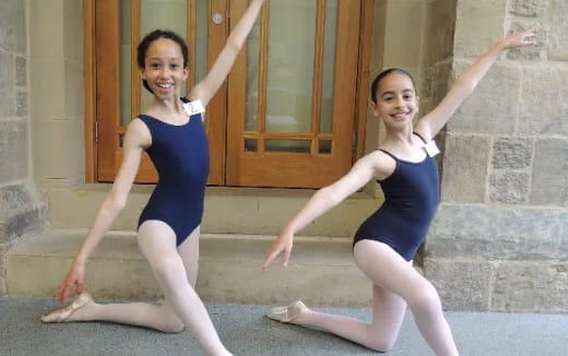 two women in leotards