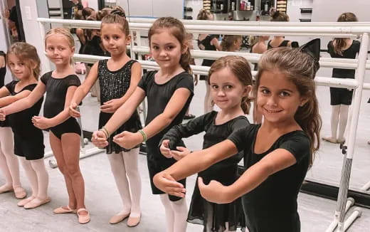 a group of girls posing for a photo